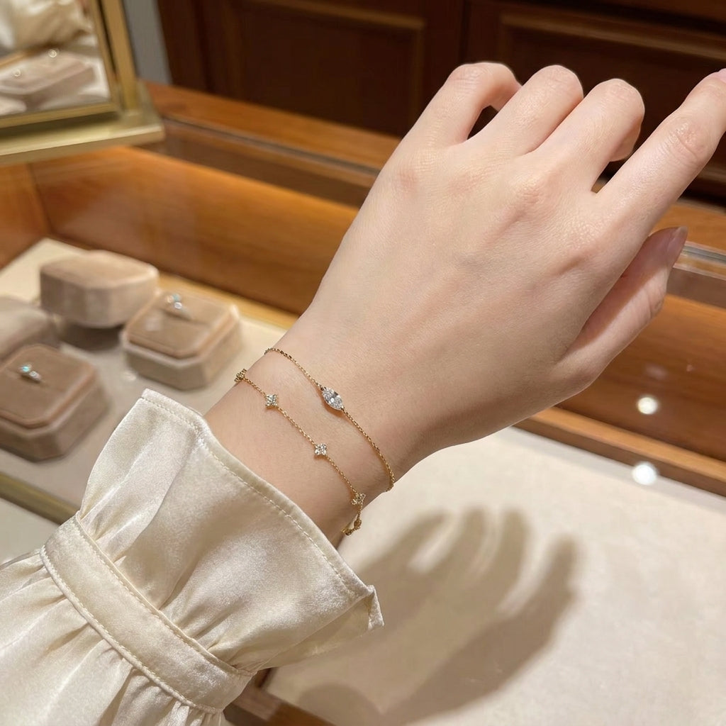 Delicate gold bracelet with faceted oval stone