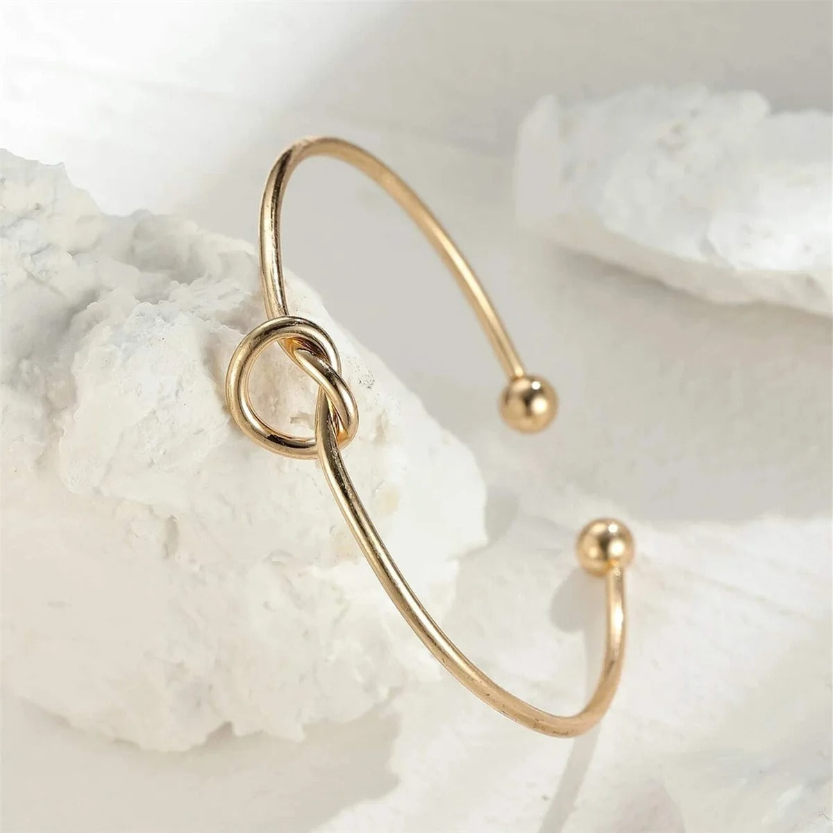 Detail of the gold rope texture on a high-quality women's jewelry piece