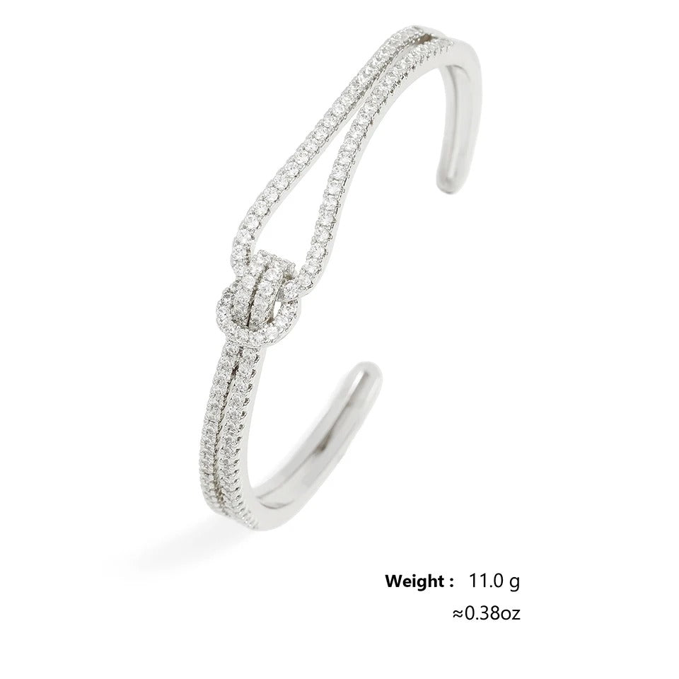 Adjustable open-cuff bracelet being adjusted for a perfect wrist fit